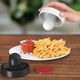 Illustration for article titled Paddle Salt and Pepper Shakers Bring Air Hockey To the Dinner Table